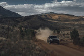 Black Tundra on a Colorado dirt road kicking up dust