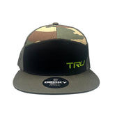 Tru Automotive seven panel trucker hat in woodland camo with black front panel and green embroidered TRU logo, front view on white background