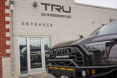 Black Toyota Tundra parked at the entrance of Tru Automotive Denver, 930 W Mississippi Ave