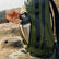 YETI Rambler water bottle clipped to a backpack on the trail